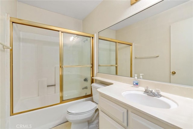 bathroom featuring vanity, toilet, and bath / shower combo with glass door