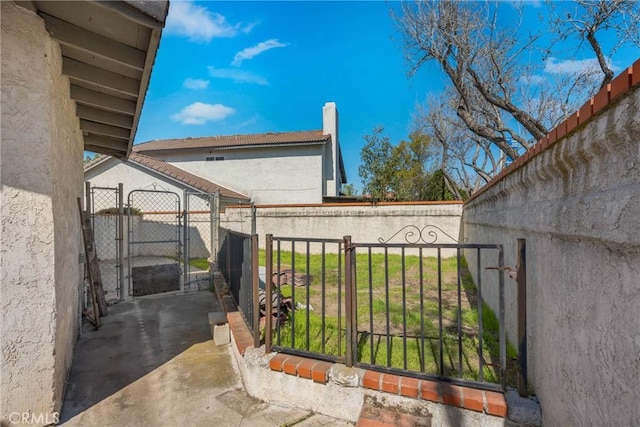 view of gate with fence