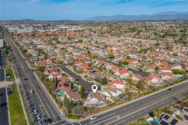 drone / aerial view with a residential view and a mountain view