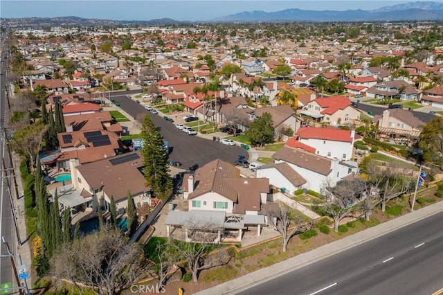 drone / aerial view featuring a residential view and a mountain view