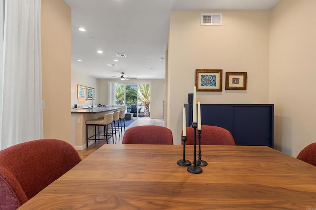 dining area with wood finished floors, recessed lighting, visible vents, and ceiling fan