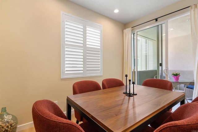 dining room with recessed lighting and baseboards