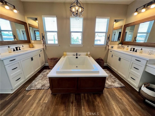 32526 Presidio Hills Ln, Winchester, CA 92596 - bathroom with wood finished floors, plenty of natural light, and two vanities