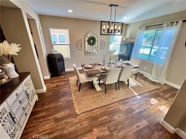 dining room with dark wood-style floors, recessed lighting, and baseboards