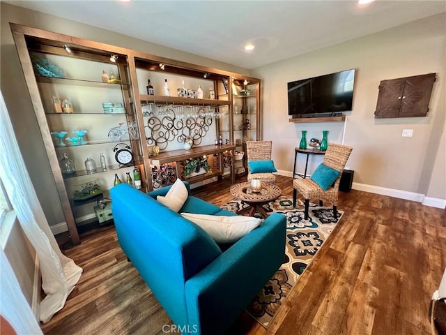 sitting room with recessed lighting, wood finished floors, and baseboards