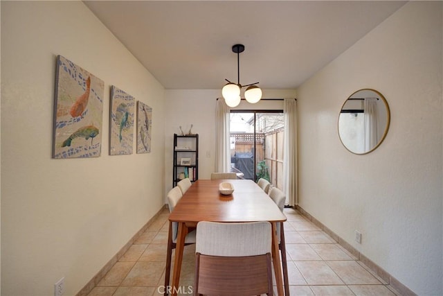 dining area with light tile patterned floors and baseboards