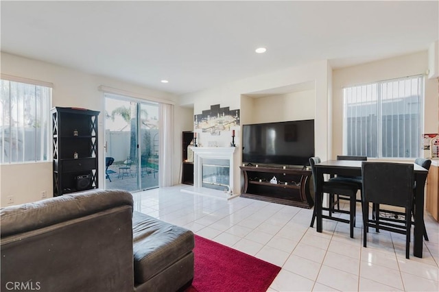 living area featuring light tile patterned floors, a wealth of natural light, and recessed lighting