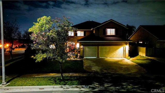 view of front of house featuring driveway and an attached garage