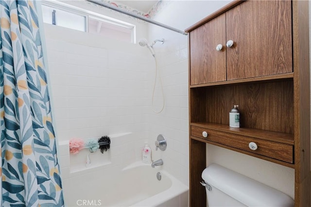 bathroom featuring toilet and shower / tub combo with curtain