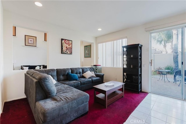 tiled living area featuring recessed lighting