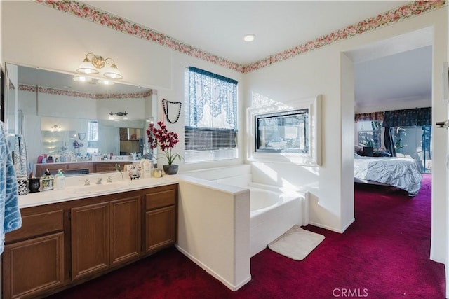 full bathroom with a garden tub, ensuite bath, and vanity