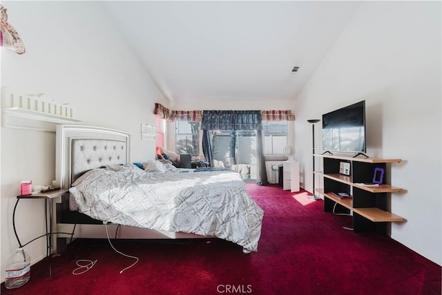 carpeted bedroom featuring high vaulted ceiling