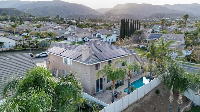 drone / aerial view featuring a residential view and a mountain view