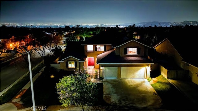 view of front of property with driveway and an attached garage