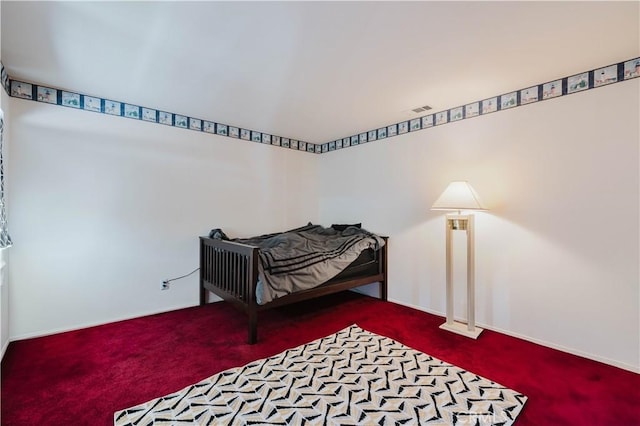 bedroom featuring baseboards and carpet flooring