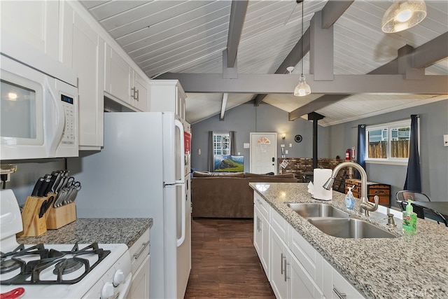 kitchen featuring dark wood finished floors, lofted ceiling with beams, open floor plan, a sink, and white appliances