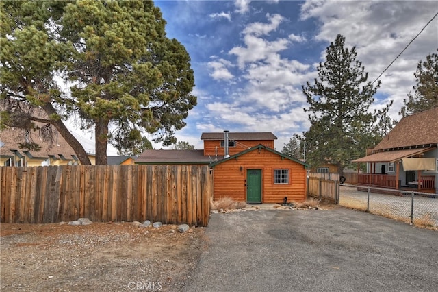 rear view of house with fence private yard