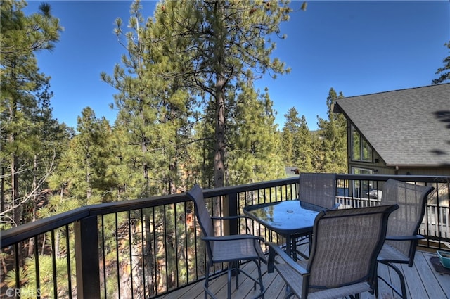 deck featuring outdoor dining area