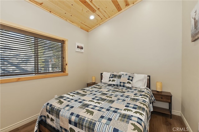 bedroom featuring wood ceiling, vaulted ceiling, baseboards, and wood finished floors