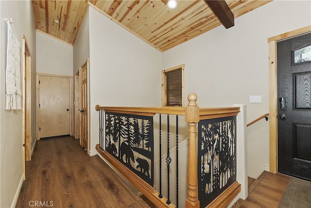 hallway with wood ceiling, vaulted ceiling, wood finished floors, and an upstairs landing