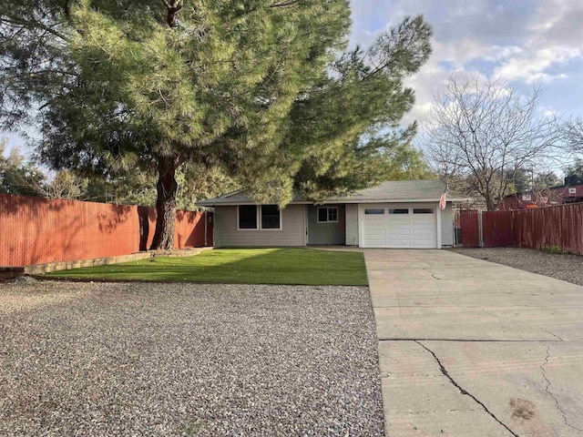 ranch-style home with a garage, driveway, a front lawn, and fence