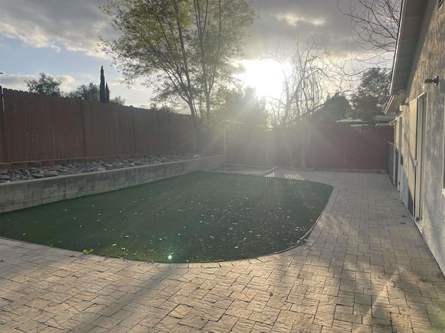 view of swimming pool featuring a patio area and a fenced backyard