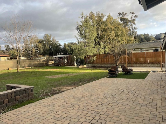 view of yard with a patio area and a fenced backyard