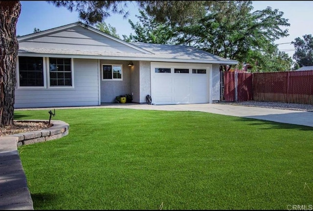 single story home with a garage, concrete driveway, fence, and a front lawn