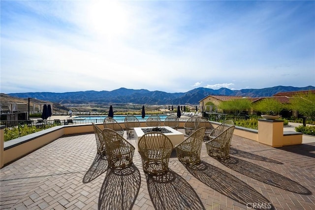 view of patio / terrace with a mountain view and a community pool