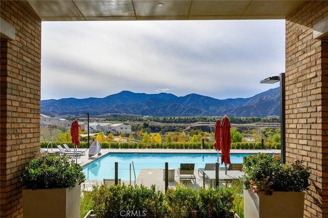 community pool featuring a mountain view