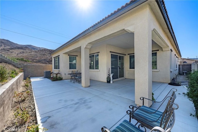 view of patio / terrace featuring a fenced backyard and a mountain view