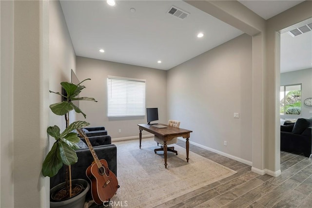 home office with baseboards, visible vents, wood finished floors, and recessed lighting