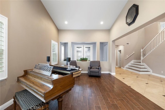 sitting room featuring stairs, recessed lighting, wood finished floors, and baseboards