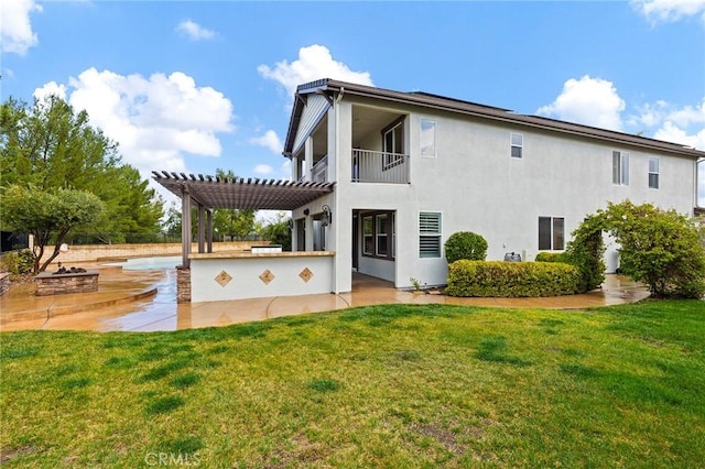 back of property featuring a patio area, a fire pit, a pergola, and a yard