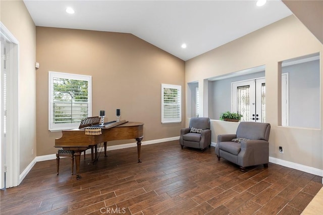 office with baseboards, vaulted ceiling, dark wood-style flooring, and french doors