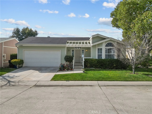 view of front facade featuring a garage, a front yard, and concrete driveway