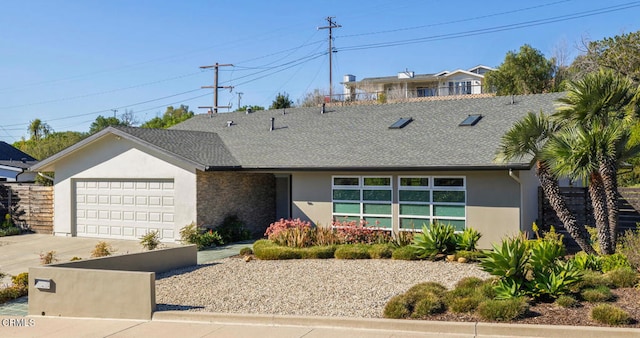 1037 Westridge Dr, Ventura, CA 93003 - view of front facade with stucco siding, roof with shingles, concrete driveway, and a garage