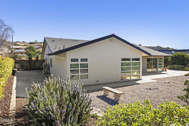 1037 Westridge Dr, Ventura, CA 93003 - view of property exterior with a patio area, roof with shingles, stucco siding, and fence