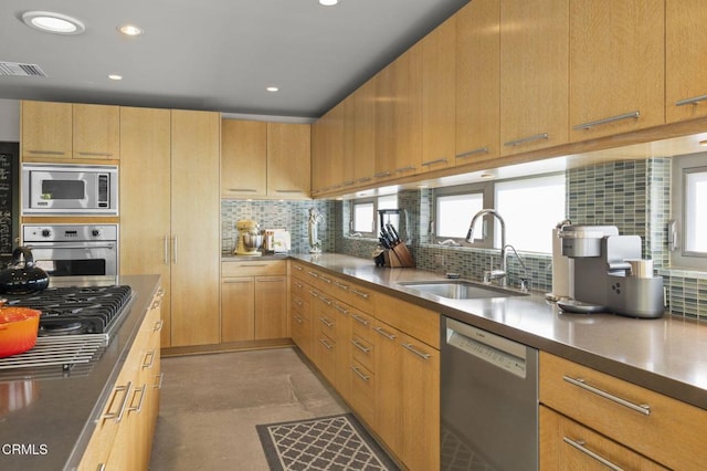 1037 Westridge Dr, Ventura, CA 93003 - kitchen featuring recessed lighting, stainless steel appliances, backsplash, visible vents, and a sink