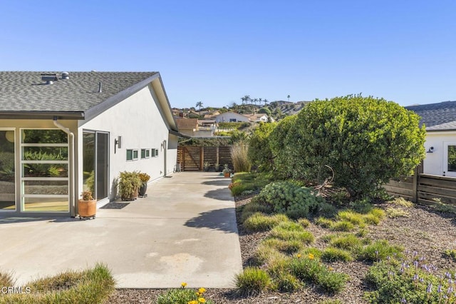 1037 Westridge Dr, Ventura, CA 93003 - view of home's exterior featuring fence, a shingled roof, and stucco siding