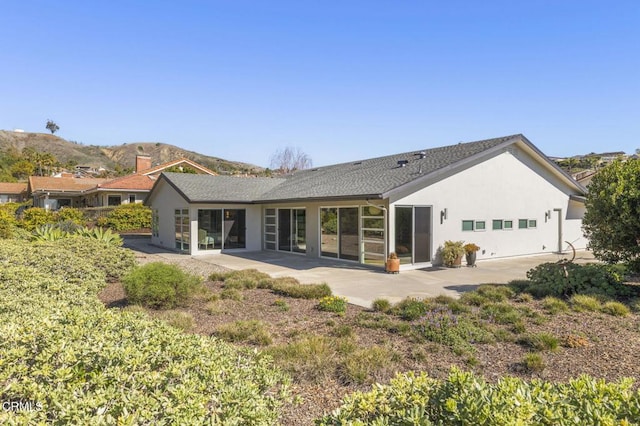 1037 Westridge Dr, Ventura, CA 93003 - back of property with a patio area, a mountain view, and stucco siding