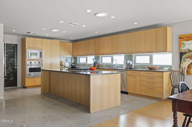 1037 Westridge Dr, Ventura, CA 93003 - kitchen with visible vents, a kitchen island, appliances with stainless steel finishes, and tasteful backsplash
