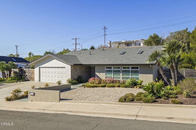 1037 Westridge Dr, Ventura, CA 93003 - ranch-style house with stucco siding, an attached garage, driveway, and fence