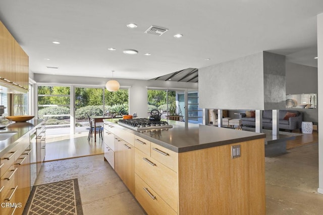 1037 Westridge Dr, Ventura, CA 93003 - kitchen with stainless steel gas stovetop, recessed lighting, light brown cabinetry, visible vents, and modern cabinets