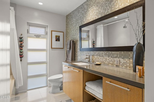 1037 Westridge Dr, Ventura, CA 93003 - bathroom with vanity, toilet, decorative backsplash, tile patterned flooring, and shower / bath combination with curtain