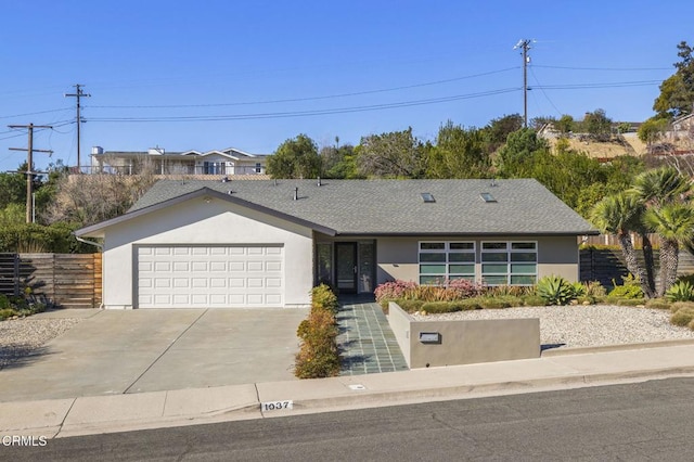 1037 Westridge Dr, Ventura, CA 93003 - ranch-style house with driveway, fence, a garage, stucco siding, and roof with shingles