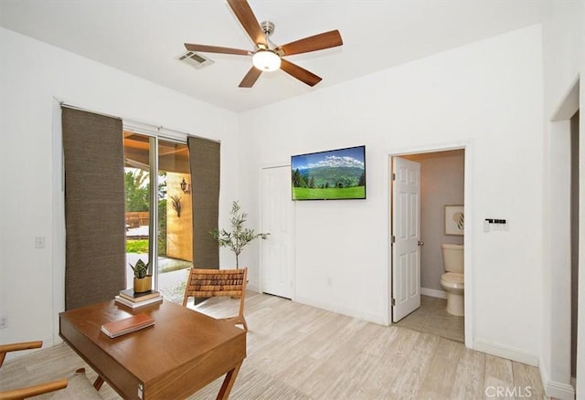 living area with ceiling fan, baseboards, visible vents, and light wood-style floors