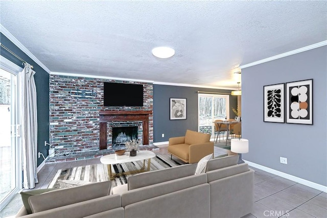 tiled living room with a textured ceiling, ornamental molding, a brick fireplace, and baseboards