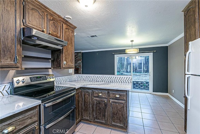 kitchen with range with two ovens, under cabinet range hood, visible vents, freestanding refrigerator, and crown molding