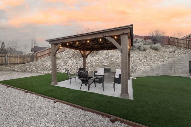 view of patio featuring a fenced backyard and a gazebo